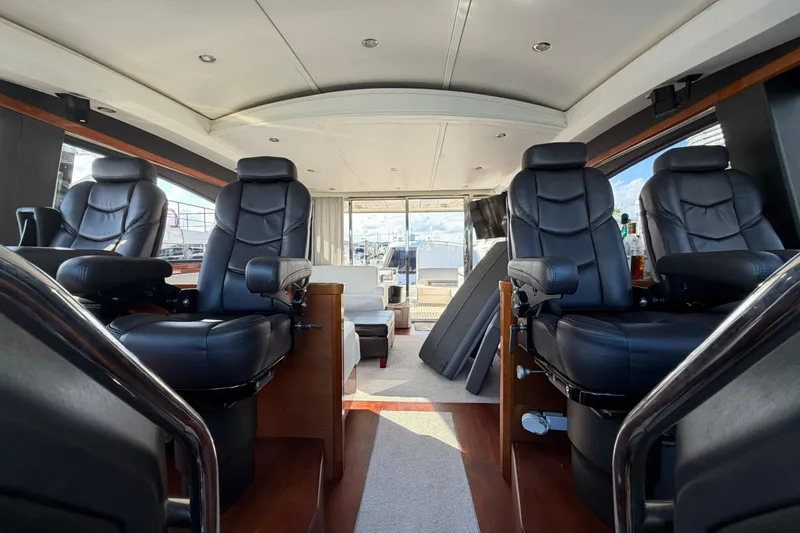 Slide: The Image of Luxurious interior of 2005 Princess V70 yacht with black leather seating and modern design. - 22