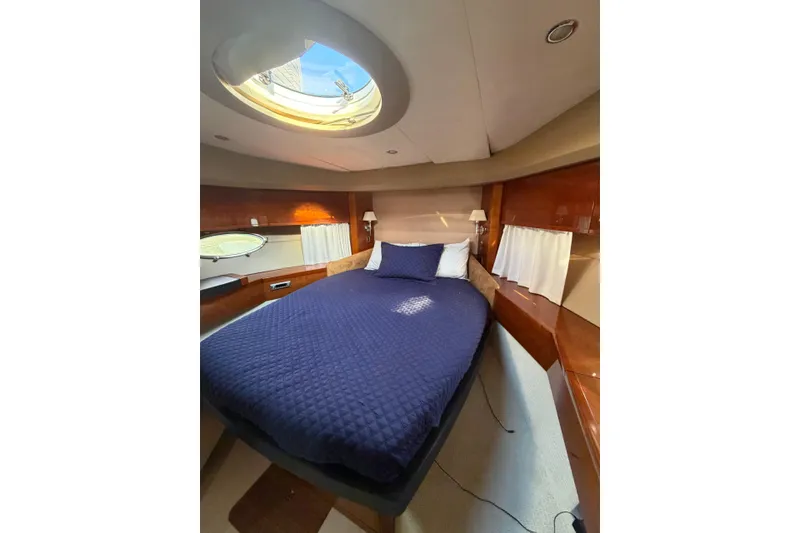 Slide: The Image of Luxurious cabin interior of 2005 Princess V70 yacht with skylight and cozy bedding. - 5