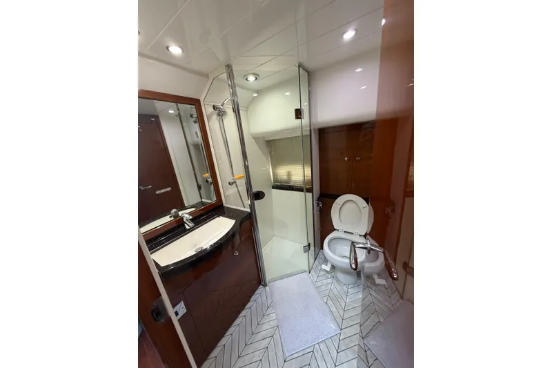 Slide: The Image of Luxurious bathroom in 2005 Princess V70 yacht with modern fixtures and elegant design. - 19