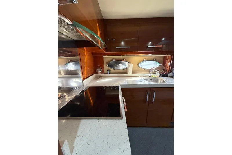 Slide: The Image of Luxurious kitchen interior of 2005 Princess V70 yacht with modern appliances and sleek design. - 21