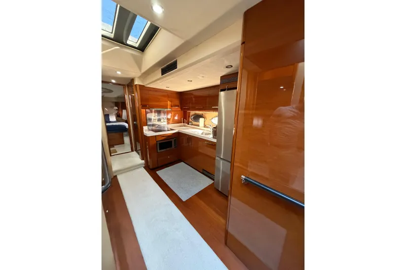 Slide: The Image of Luxurious 2005 Princess V70 yacht interior with modern kitchen and wood finishes. - 7