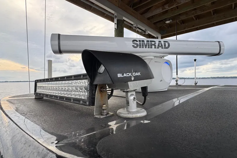Slide: The Image of 2023 Tidewater 320 CC Adventure boat with Simrad and Black Oak equipment on deck. - 34