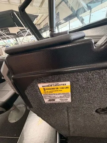 Slide: The Image of Interior view of a boat with a capacity warning for 8 persons or 1100 pounds. - 12