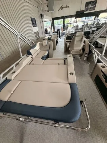 Slide: The Image of The image shows the interior of a 2027 Avalon LSZ 2385 VRB with beige and blue seating. - 14