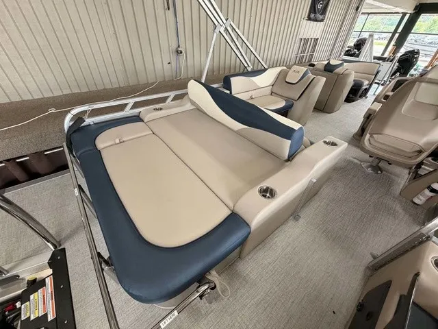Slide: The Image of The image shows the interior of a 2027 Avalon LSZ 2385 VRB with beige and blue seating. - 11