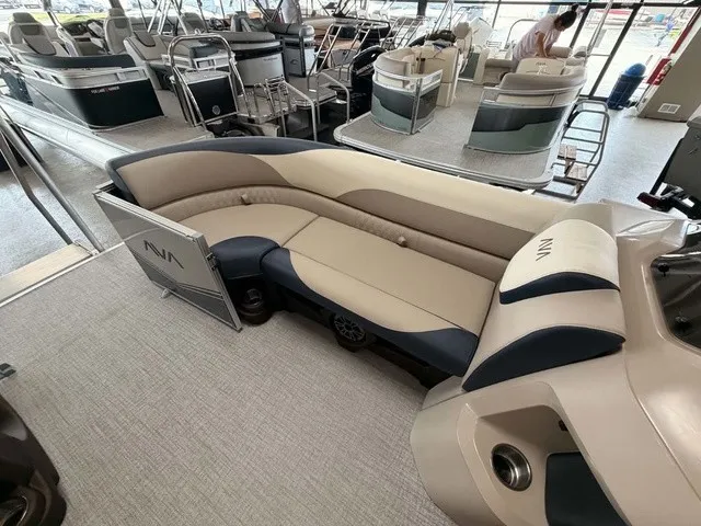 Slide: The Image of The image shows the interior of a 2027 Avalon LSZ 2385 VRB with beige and blue seating. - 4