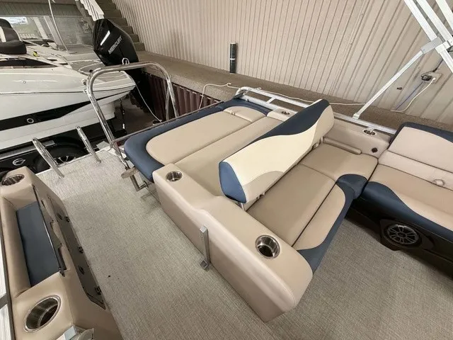 Slide: The Image of The image shows the interior of a 2027 Avalon LSZ 2385 VRB with beige and blue seating. - 10