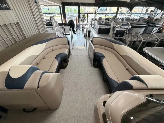 Slide: The Image of The image shows the interior of a 2027 Avalon LSZ 2385 VRB with beige and blue seating. - 5