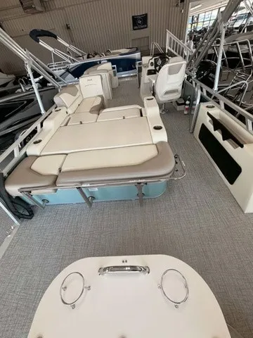 Slide: The Image of The image shows the interior of a 2027 Avalon VEN 23E85 VRB. It features beige upholstery and spacious seating. - 14