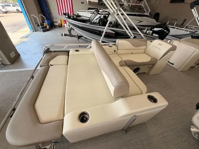 Slide: The Image of The image shows the interior of a 2027 Avalon VEN 23E85 VRB with beige upholstery. - 11