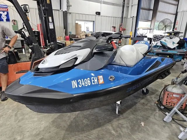 The Image of A blue 2021 Sea-Doo GTI SE 130 jet ski is in a workshop. - 1