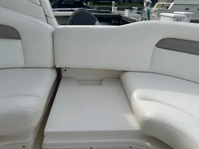 Slide: The Image of 2003 Sea Ray 340 Sundancer white leather seating area on deck - 31