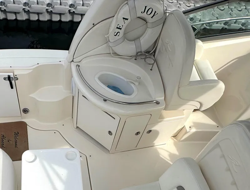 Slide: The Image of 2003 Sea Ray 340 Sundancer boat interior with seating and life preserver. - 30