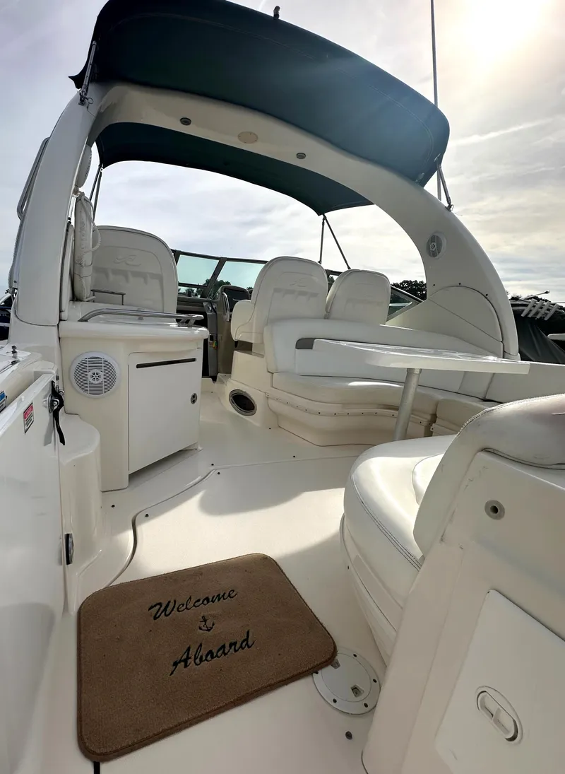 Slide: The Image of 2003 Sea Ray 340 Sundancer boat interior with Welcome Aboard mat. - 11