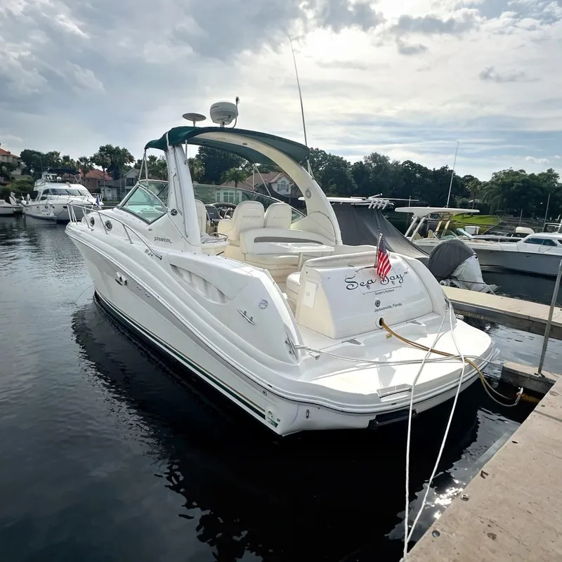 Slide: The Image of 2003 Sea Ray 340 Sundancer yacht docked at marina, rear view. - 0