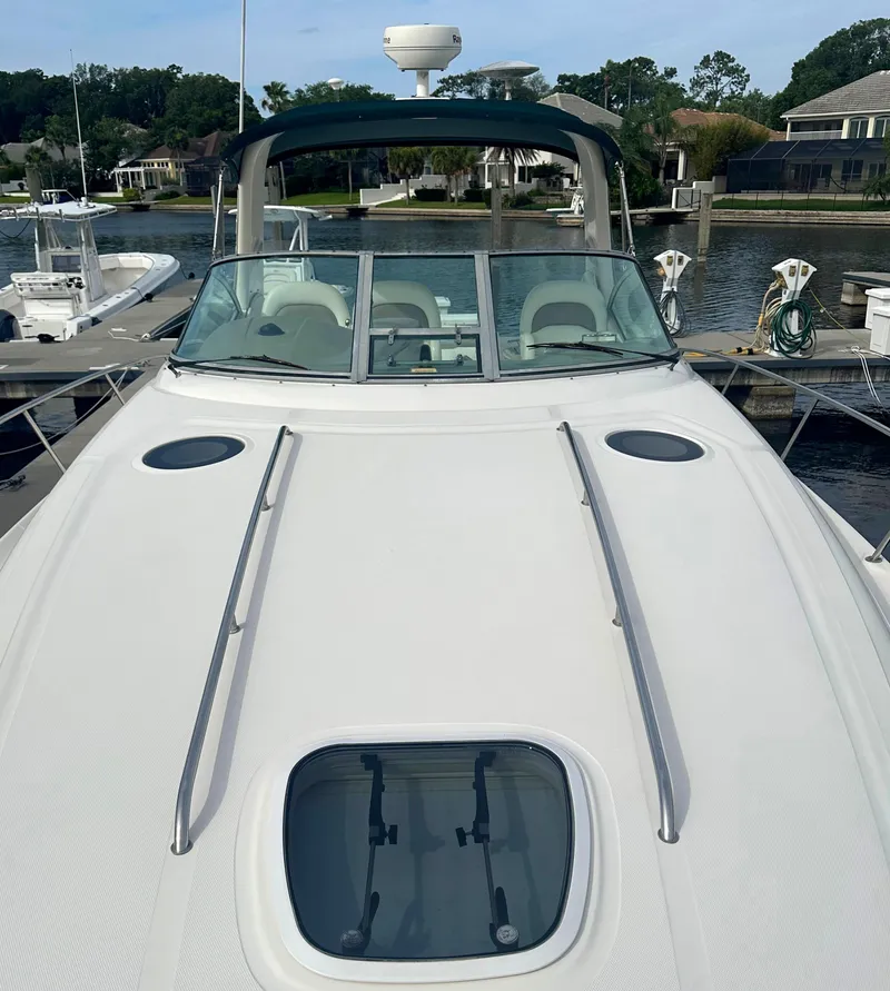 Slide: The Image of 2003 Sea Ray 340 Sundancer docked at a marina. - 19
