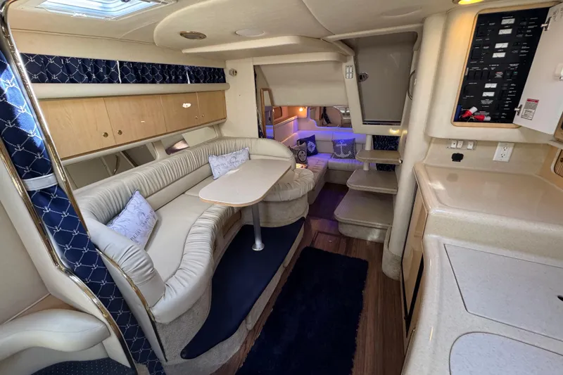 Slide: The Image of Interior of 2001 Sea Ray 340 Sundancer yacht with cozy seating and modern amenities. - 29