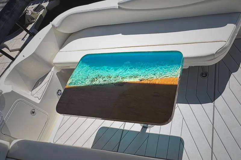 Slide: The Image of Luxury Sea Ray 340 Sundancer 2001 with custom ocean-themed table design. - 10