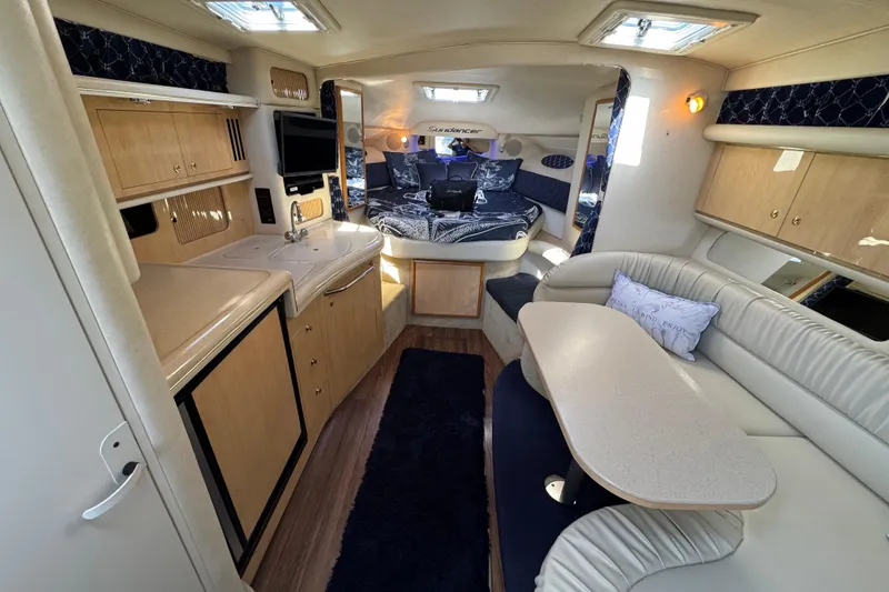 Slide: The Image of Luxurious interior of a 2001 Sea Ray 340 Sundancer yacht with modern amenities. - 25