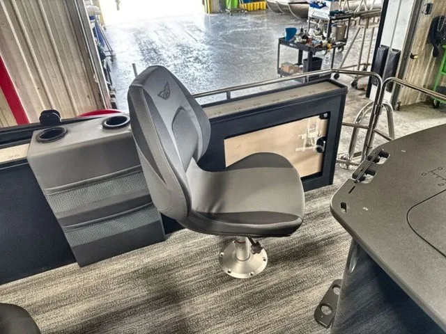 Slide: The Image of A gray captain's chair on a Bennington M Fishing 22 MFC Tritoon boat. - 18