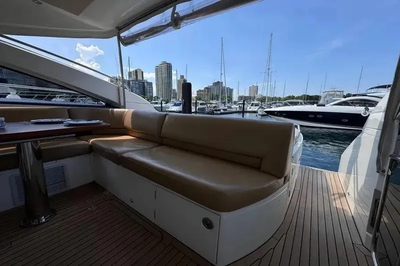 Slide: The Image of Luxurious 2008 Princess V53 yacht interior with marina view and comfortable seating. - 22