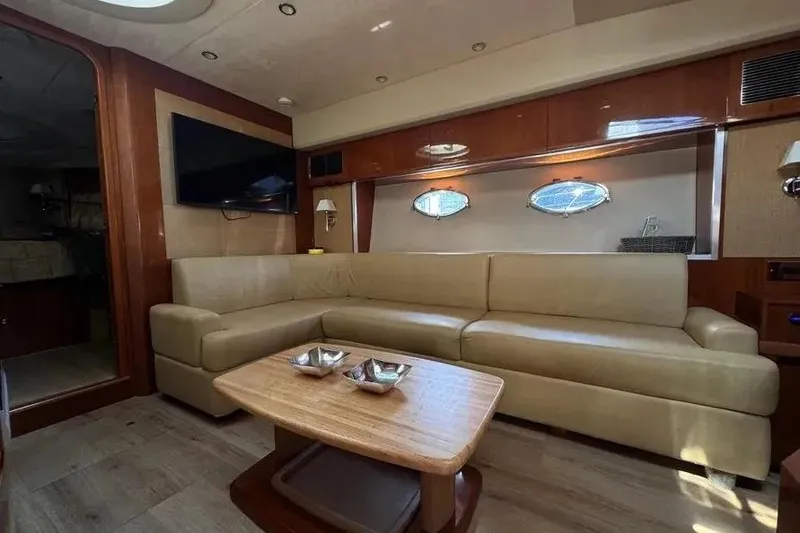Slide: The Image of Luxurious interior of 2008 Princess V53 yacht with beige leather seating and wooden accents. - 17