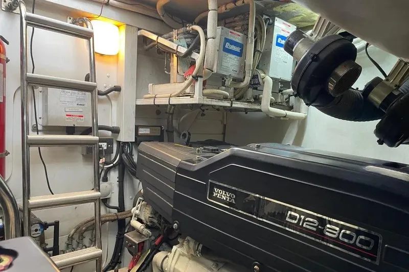 Slide: The Image of Engine room of a 2008 Princess V53 yacht featuring a Volvo Penta D12-800 engine. - 44