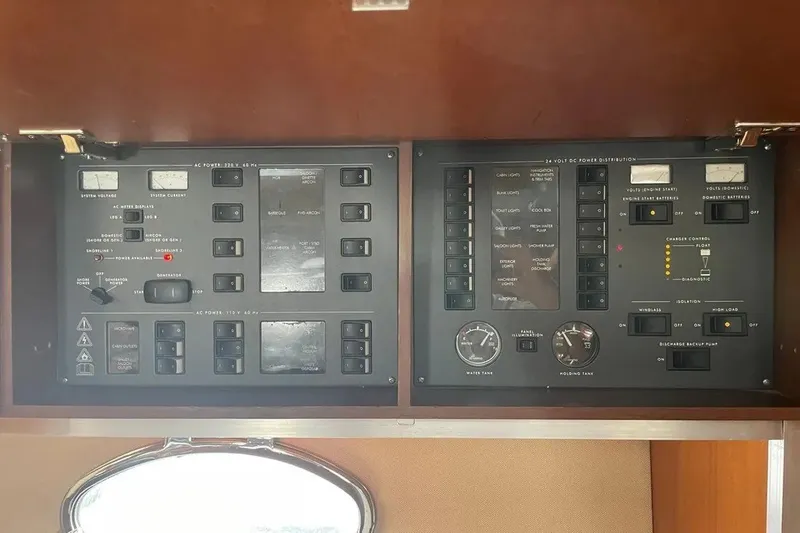 Slide: The Image of Control panel of a 2008 Princess V53 yacht, featuring various switches and gauges. - 35