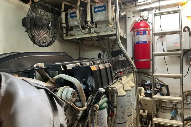 Slide: The Image of Engine room of a 2008 Princess V53 yacht with machinery and safety equipment. - 42