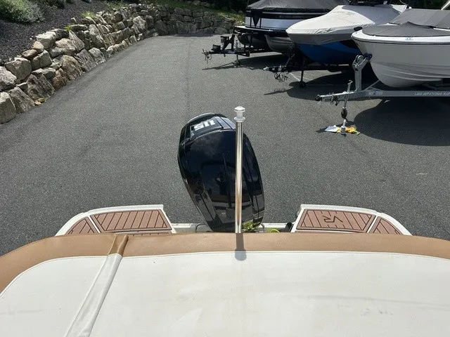 Slide: The Image of The image shows the stern of a 2022 Bayliner VR5 Bowrider OB with an outboard motor. - 16