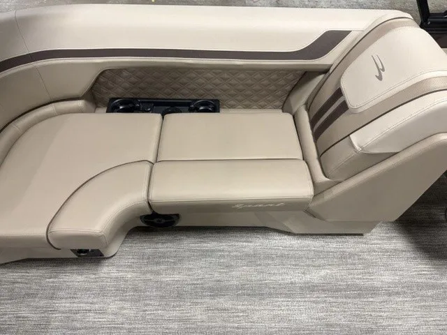 Slide: The Image of Luxurious beige bench seat with quilted pattern and cup holders on a boat. - 15