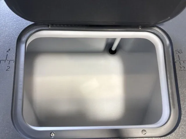 Slide: The Image of An open storage compartment on a Bennington S Fishing 22 SFC Tritoon boat. - 15