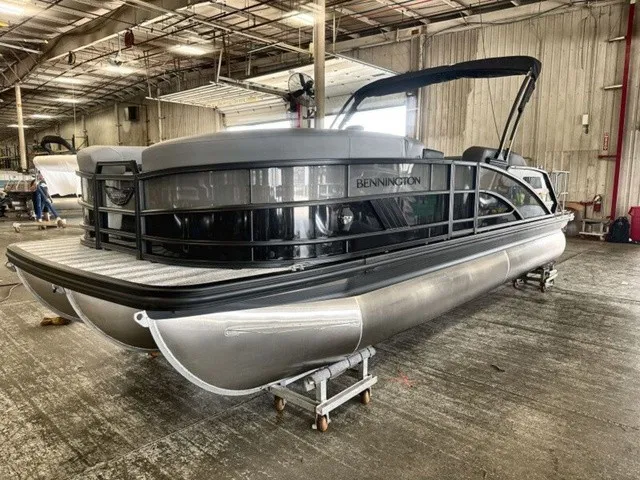 Slide: The Image of 2027 Bennington M Fishing 22 MFC Tritoon in a warehouse setting. - 4