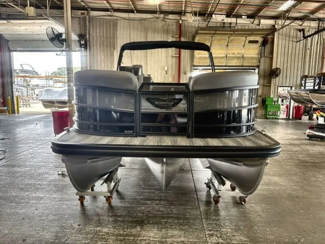 Slide: The Image of 2027 Bennington M Fishing 22 MFC Tritoon in a warehouse setting. - 3