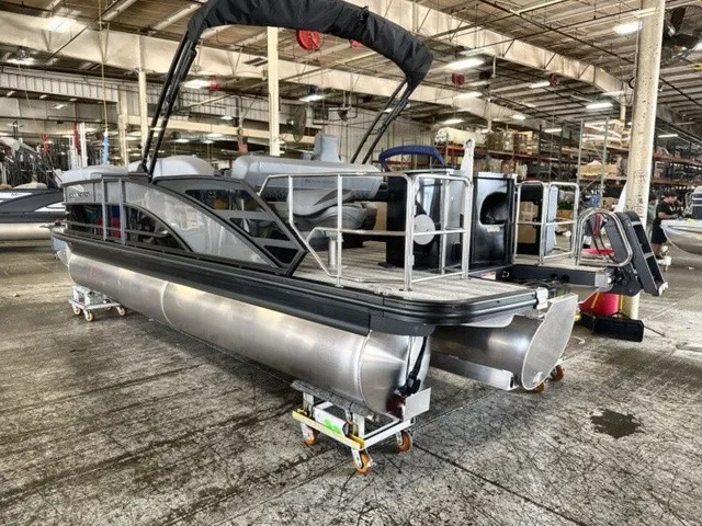Slide: The Image of A 2027 Bennington M Fishing 22 MFC Tritoon is in a warehouse on dollies. - 6