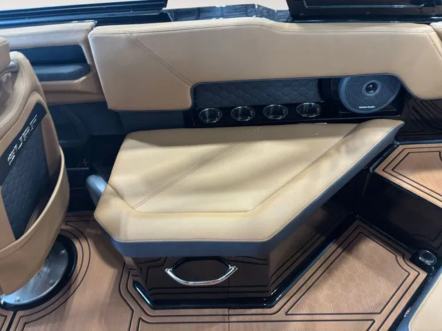 Slide: The Image of Interior of a 2027 Cobalt R4 Surf with beige upholstered seating and speaker. - 10