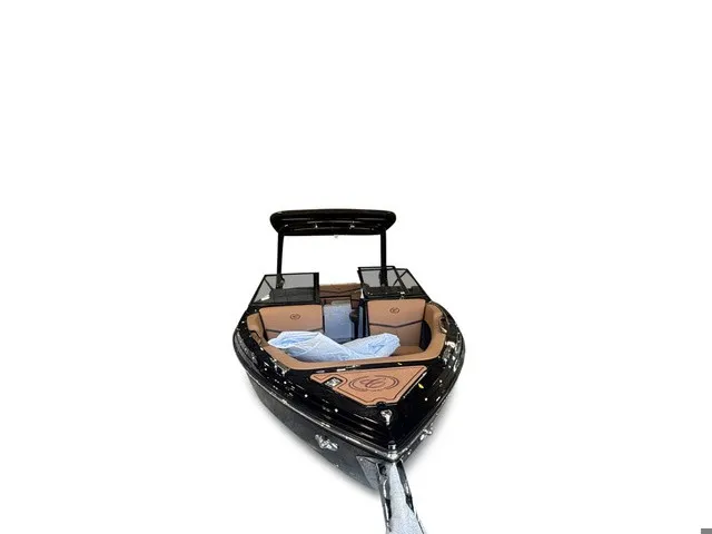 Slide: The Image of The image shows a sleek 2027 Cobalt R4 Surf boat with brown seats and a black hull. - 3