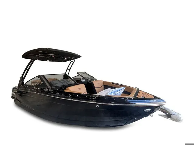 Slide: The Image of The image shows a sleek black 2027 Cobalt R4 Surf boat with brown seating. - 2