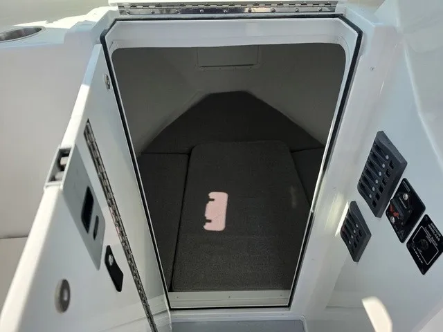 Slide: The Image of The image shows the entrance to a cabin with gray upholstery and control panels on the side. - 9