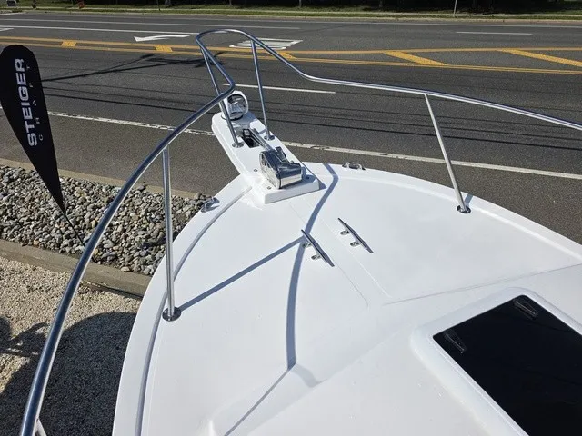 Slide: The Image of The image shows the bow of a Steiger Craft 21 Miami boat with stainless steel railing. - 11