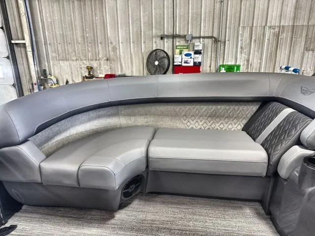 Slide: The Image of The gray upholstered seating in a boat offers ample comfort and style. - 11