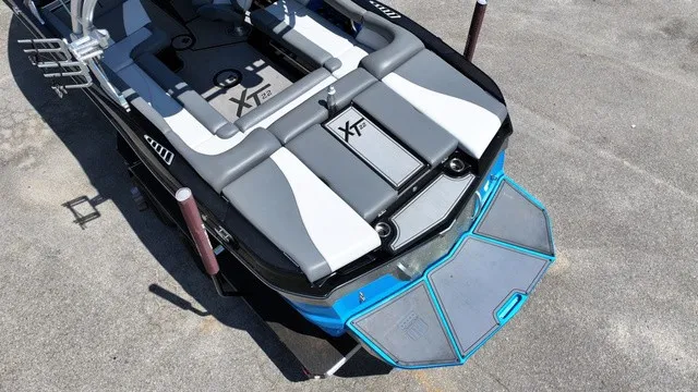Slide: The Image of The image shows a 2019 MasterCraft XT22 boat with gray and blue accents. - 8