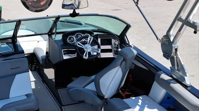 Slide: The Image of The image shows the cockpit of a 2019 MasterCraft XT22 with modern instruments and comfortable seating. - 5