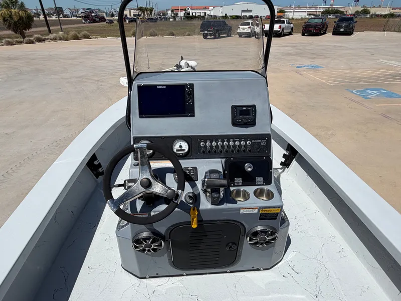 Slide: The Image of The image shows the helm of a 2023 Blazer Bay 2220 GTS boat with modern instruments. - 19