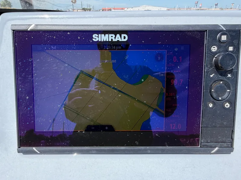 Slide: The Image of A Simrad navigation system on a boat displays a map with course information. - 20