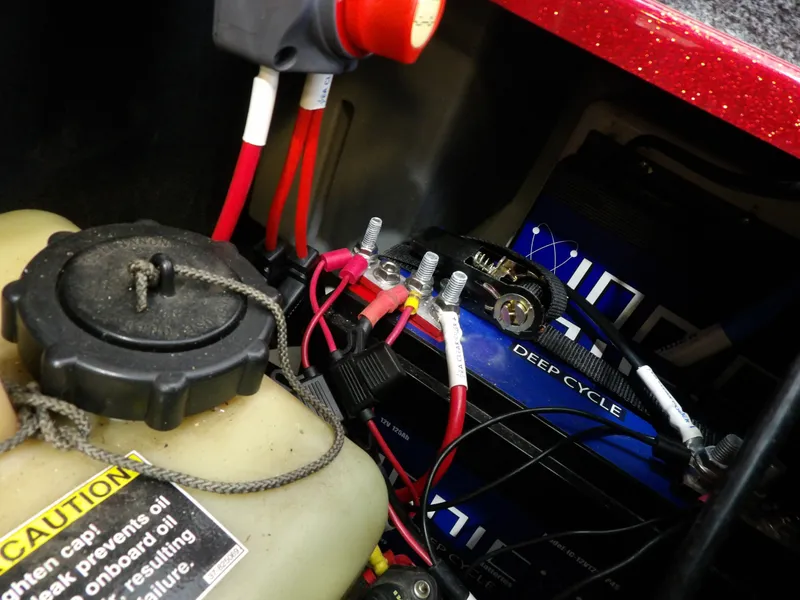 Slide: The Image of Close-up of a boat battery with cables and a fuel tank. - 27