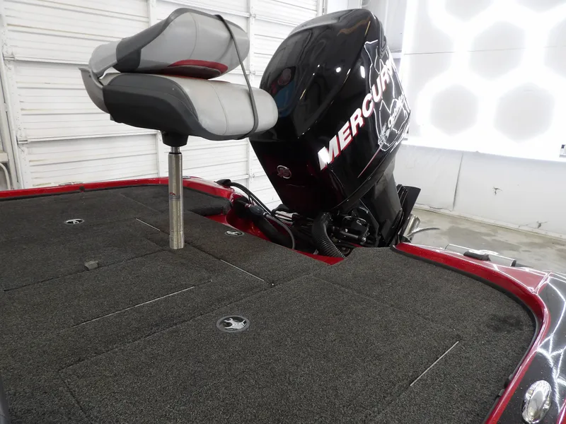 Slide: The Image of A 2010 Nitro Z-7 boat with a Mercury outboard motor. It features a cushioned seat and carpeted deck. - 17
