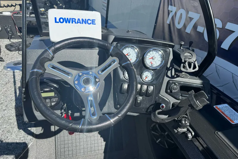 Slide: The Image of Steering console of 2025 Tracker Targa V-18 Combo boat with Lowrance electronics. - 14