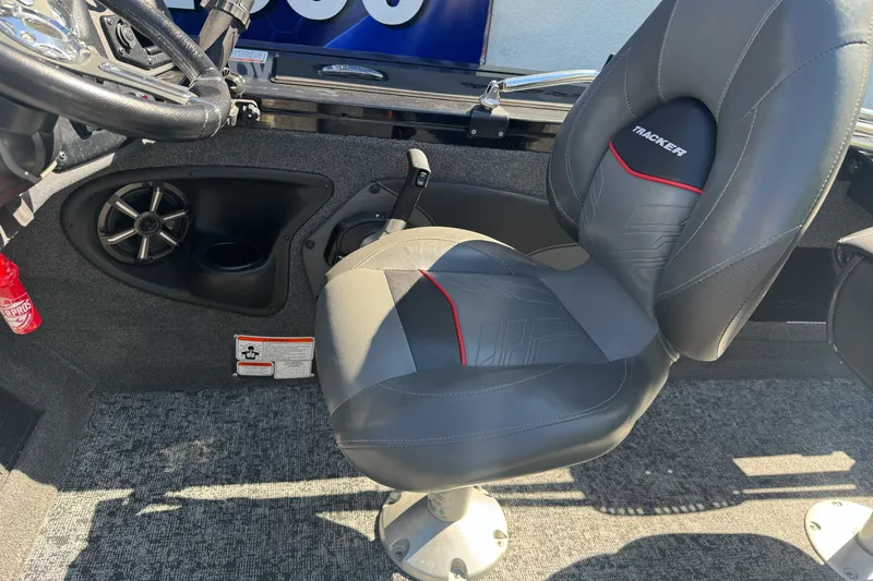 Slide: The Image of 2025 Tracker Targa V-18 Combo boat interior with gray seat and steering wheel. - 15