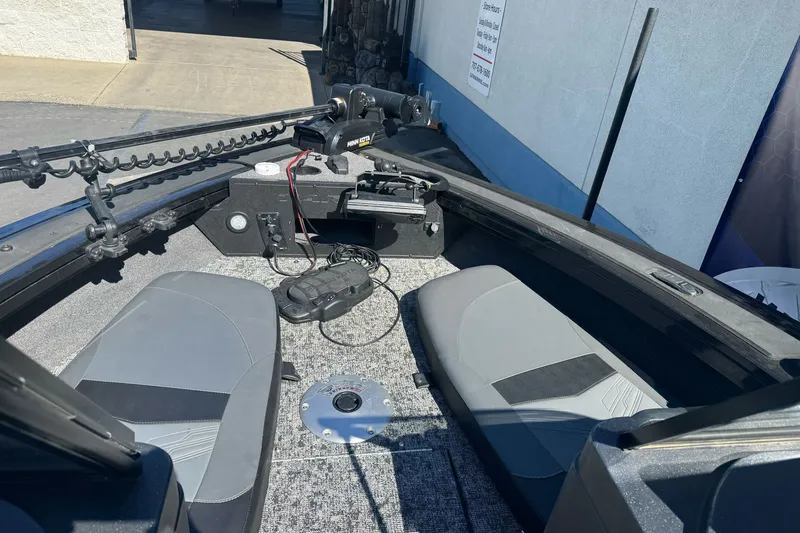 Slide: The Image of 2025 Tracker Targa V-18 Combo boat interior with seating and fishing equipment. - 20